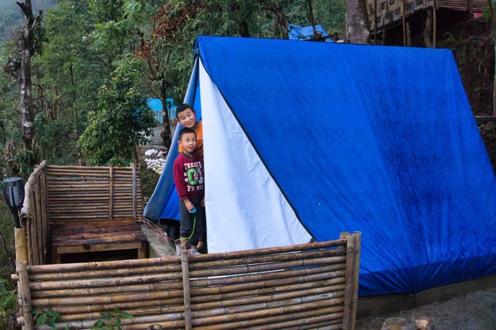 children enjoying their time at Gangtok View Camping with cozy tent set up in a scenic outdoor location in Gangtok Sikkim